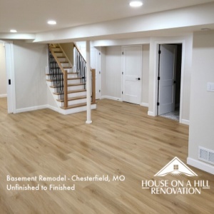 Bright and spacious finished basement with wood flooring and white walls, ready for move-in.